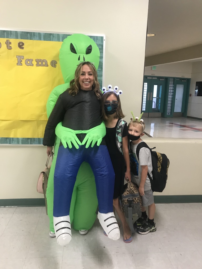 Mrs. Christensen with her SME students Amelia and Dax participating in Spirit week.  Today's theme:  Spaced Out Thursday!!